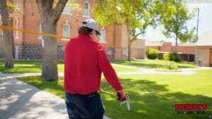 Newby's tech spraying lawn